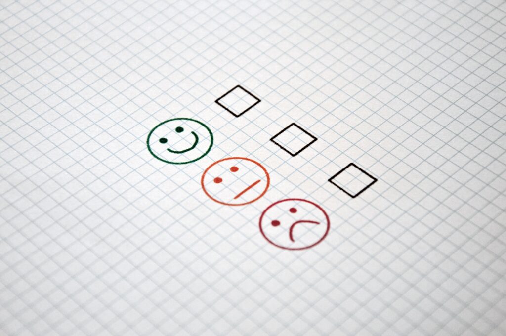 A feedback form with happy and sad face options, representing linguistic quality assurance